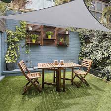 The 10 Commandments Of Decorating A Tiny Outdoor Space Small Outdoor Patios Small Outdoor Spaces Outdoor Patio Designs