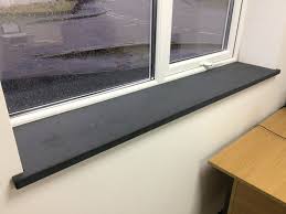 I cut it to be 4 1/2″ longer on each end of the window sill, then used my jigsaw to notch out the wood so that it would fit inside the window sill, with the overhang on each side. Welsh Sills Steps Berwyn Slate