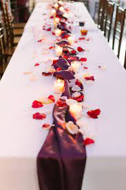 Partner your rose petals with unusual shapes and contrasting textures to create decorative focal points. Romantic Wedding Table Centerpiece For A Long Table Maroon White Elegant Weddin Long Table Wedding Wedding Table Centerpieces Flower Centerpieces Wedding