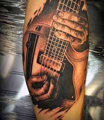 This kind of guitar tattoos for guys has become trendier among the rock stars. 65 Guitar Tattoos For Men Acoustic And Electric Designs Tattoos For Guys Music Tattoos Guitar Tattoo