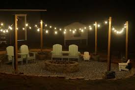 Fire Pit Edison Lights Adirondacks Bonfire And Smores Make A Beautiful Night Outdoor Fire Pit Backyard Lighting Diy Beach Fire Pit