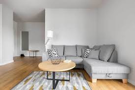 An area rug under your bed keeps your toes warm while adding color to your floor. How To Place A Rug Under A Sectional Sofa Home Decor Bliss