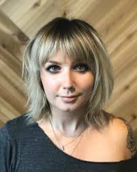 The cool tones in the deep purple medium hairstyle with bangs contrast well with the warmth in the milk. Top 49 Choppy Bob Hairstyles Cute Textured Bobs For 2021