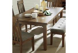 Dining room table marble kitchen & dining tables Benchcraft Flaybern 10082484 Rectangular Dining Room Self Storing Butterfly Leaf Table Pilgrim Furniture City Dining Tables