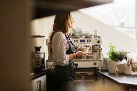 Coffee machines for home nzz folio client newsletter. Barista Serving Coffee To Customer In Cafe Stockphoto