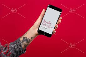 Mockup Featuring A Woman S Tattooed Arm Holding A Space Gray Iphone 8 Against A Red Surface Lovely Mockups Arm Tattoo Tattoos For Women Iphone