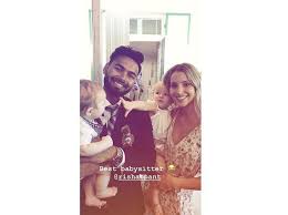 Rishabh pant has a safe pair of hands! Good Sport Rishabh Pant Turns Baby Sitter For Tim Paine S Young Children Business Standard News