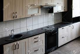 Check spelling or type a new query. Wooden Kitchen With Black Worktop Interior Design Stock Photo Picture And Royalty Free Image Image 77028477