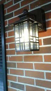 Hampton bay essen antique copper outdoor wall lantern. Hampton Bay Mission Style Black With Bronze Highlight Outdoor Wall Lantern With Built In Electrical Outlet Gfci 30264 The Home Depot Wall Lantern Outdoor Wall Lantern Outdoor Wall Lighting