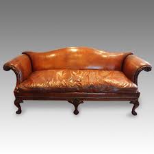 A large chippendale period mahogany framed sofa with camel shaped back and strongly shaped scroll arm. Edwardian Camel Back Leather Sofa Hingstons Antiques Dealers