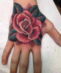 Blue diamond and red rose tattoo on left hand. 47 Rose Hand Tattoos For Women