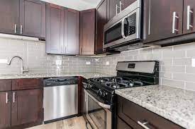 Buy cheap kitchen cabinets near me for less money than the retail giants. Modern Apartment Kitchen With Dark Cabinets Grey Subway Tile Backsplash Grani Gray Subway Tile Backsplash Backsplash With Dark Cabinets Redo Kitchen Cabinets