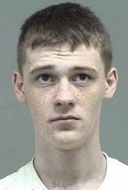 Man charged with armed robbery, suspect sought