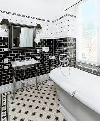Vertical white tile pops against the surrounding black bathroom walls, chrome fixtures, and provides an interesting line of demarcation for the shower stall. Black And White Bathrooms Design Ideas Decor And Accessories White Bathroom Decor Black Bathroom Decor Black And White Tiles Bathroom