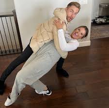 I thought I was going to pass out!' Dancer Derek Hough surprises local  woman at her house with help from his cousin