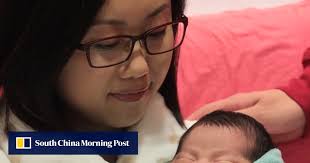 Hong Kong's first baby of 2015 arrives 12 days early to see in the New Year 