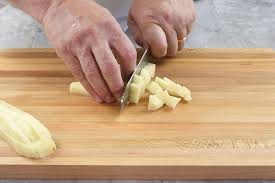 Turn the potato onto this base so that it won't roll around while you do the rest of your cutting. How To Cut Potatoes 3 Ways