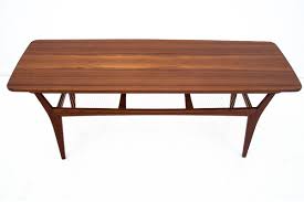 Danish modern vintage tables offer up clever designs convenient for living and entertaining in style. Danish Teak Coffee Table 1960s