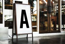 Download Premium Psd Of Blank Mockup Board In Front Of A Restaurant 295706 Sign Mockup Storefront Signage Picture Frame Designs