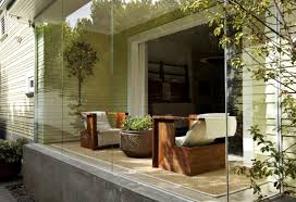 Modern sunroom in white with a variety of indoor plants [from: 6 Ideas For A Modern Sunroom Youramazingplaces Com