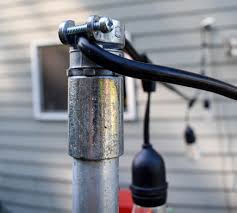 Slip over sign brackets for use as street sign holders. Easy Diy String Light Poles Tutorial Jessica Welling Interiors