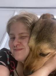 When the only picture you can get of your high energy puppy dog is "Movie  Night". She has to hold hands ALL THE TIME.🥰🤣🤣 Daisy Jane aka Daisy the  Destroyer.