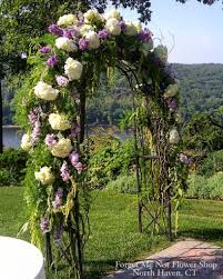 Black And White Wedding Arch Decorations Arch Decorated With Purple And White Flowers And Greens For An Outdoor Wedding Ceremony Purple And White Flowers Order Wedding Flowers Church Wedding Flowers