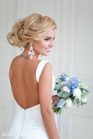 An illusion back with placed lace or intricate beading gives an extra pop of glamor to any gown. Wedding Hairstyles Updo Wedding Hair Style And Backless Wedding Dress Listfender Leading Inspiration Magazine Shopping Trends Lifestyle More