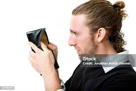 Man Looking Up Into His Empty Wallet Stock Photo