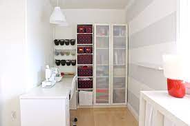 This craft room features maple melamine for the basic material with maple countertop/crown and brushed chrome baskets for her craftroom. Sewing Room Makeover Before And After Made Everyday