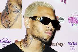 Chris brown insists his absurd new neck tattoo is not rihanna. Chris Brown Tattoos Battered Woman S Face On Neck Billboard