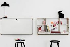 Door flips down for work surface for paying. Junior Living S Wall Hanging Desk