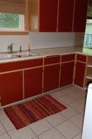 The salmon wall was first on my list to red marble, huh? Painting Cabinets To Make A Kitchen Look Bigger Thriftyfun