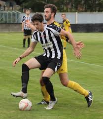 Scott Hellewell heading across goal.