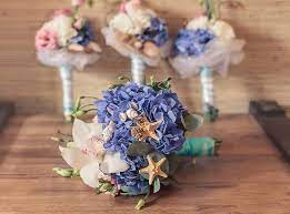 Beach seaside wedding bouquet, destination wedding bouquet, seashell starfish bouquet, coral, turquoise, white from $85.00 sea side wedding bouquet, dark turquoise, teal calla lilies, ivory roses, beach, seashell, accent, silk orchid, destination wedding 20 Beach Wedding Bouquet Ideas Seashells And Flowers