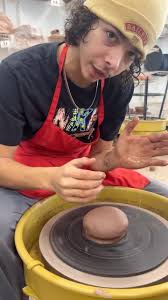 In this semester’s ceramics class at Barry University, students like Javoni  Rivera are learning the basics of pottery, starting with centering clay