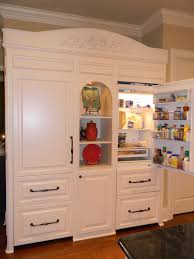 A deep cabinet above the refrigerator is a good place for tray storage or even a tv, as shown here. Pin On My Style