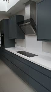 Graphite Grey Modern Kitchen With White Silestone Work Tops Designed And Fitted By Orchardkitche Modern Grey Kitchen Kitchen Room Design Modern Kitchen Design