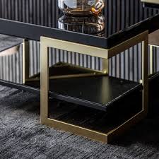 Pairs black glass with gleaming gold metal. Vinicius 90cm Square Glass Coffee Table Black Knees Co Uk