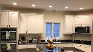 Your guests will be wowed by your stunning granite countertops, stainless steel sink and glass tile backsplash. Heartwood Cabinet Refacing Cabinet Refacing