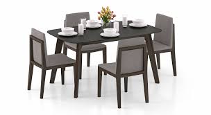 Create functional drama by pairing seating, lighting if strict geometry doesn't float your boat, be sure to offset bulky items, like couches and loveseats, with a coffee table and a pair of chairs. Dining Tables Upto 20 Off Buy Wooden Dining Table Sets Online Urban Ladder