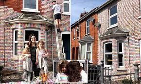 For this house, benjamin moore classic gray for the trim, hale navy as the primary color, storm as the secondary color and cheating heart for the front door. Family Of Four Spend Six Hours Colouring Every Brick Of Their Terraced House In Chalk Daily Mail Online
