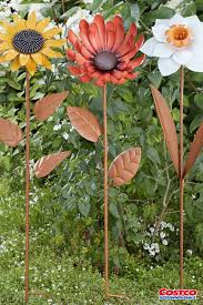 This bright blue flower has a unique river rock mosaic center. Colorful Metal Flower Stake Metal Flowers Flowers Types Of Flowers