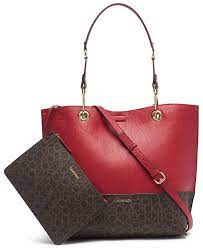 The epitome of minimalist chic, calvin klein transfers his love of clean lines seamlessly across the label's accessory and lingerie collection. Calvin Klein Signature Reversible Tote With Pouch Reviews Handbags Accessories Macy S