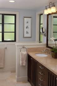 Bathroom mirrors with back lights eliminate the need for sconces. San Francisco Kirklands Wall Mirrors Bathroom Traditional With Dark Wood Cabinets Lever Handles Stone Flooring