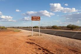 The tropic of capricorn lies at 23.5 degrees south of the equator and runs through australia, chile, southern brazil (brazil is the only country that passes through both the equator and a. Tropic Of Capricorn Signpost Stock Image C013 7230 Science Photo Library