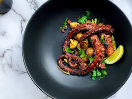 Stir in the paprika, bay leaf, potatoes, salt, and a little of the potato water. Pacific Grilled Octopus