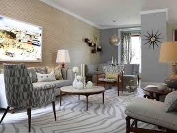 There's an exercise bike to let off steam (not shown) and a small desk by the window that makes a handy office. Graphic Patterns And Midcentury Modern Style Go Together Like Milk And Coo Farmhouse Decor Living Room Mid Century Modern Living Room Mid Century Modern Living