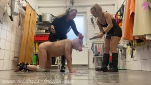 Mistress Kristins Clipstore | Dolora and Kristin in black rubberboots