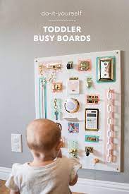 How To Make Adorable Toddler Busy Boards Without Power Tools Toddler Activity Board Baby Play Activities Toddler Activities